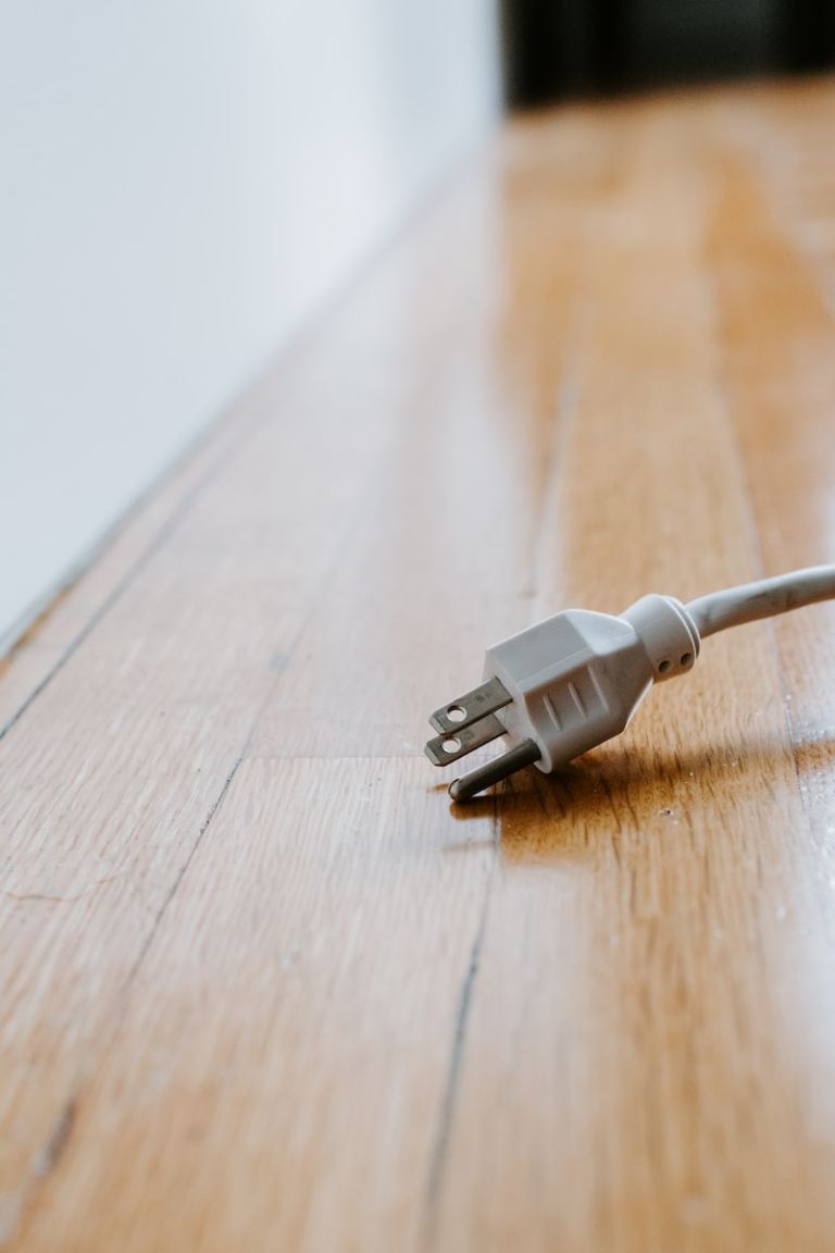 white usb cable on brown wooden table